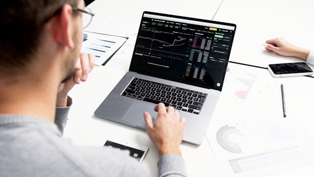 Graphic showing various options trading strategies, including covered call, cash-secured put, long call, long put, and vertical spread, with financial charts and trading symbols.