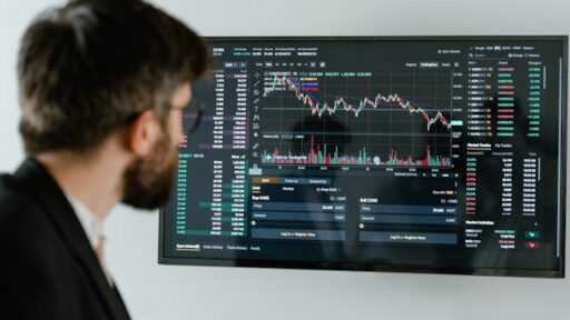 A trader using OptionsWatch to analyze options trading strategies, including strangles and straddles for better market decisions.