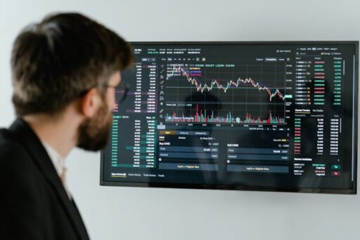 A trader using OptionsWatch to analyze options trading strategies, including strangles and straddles for better market decisions.