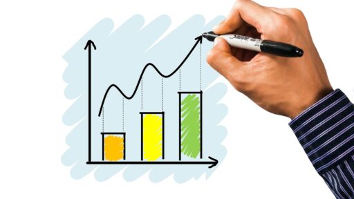 A beginner trader analyzing stock charts on a laptop screen, learning trading strategies.